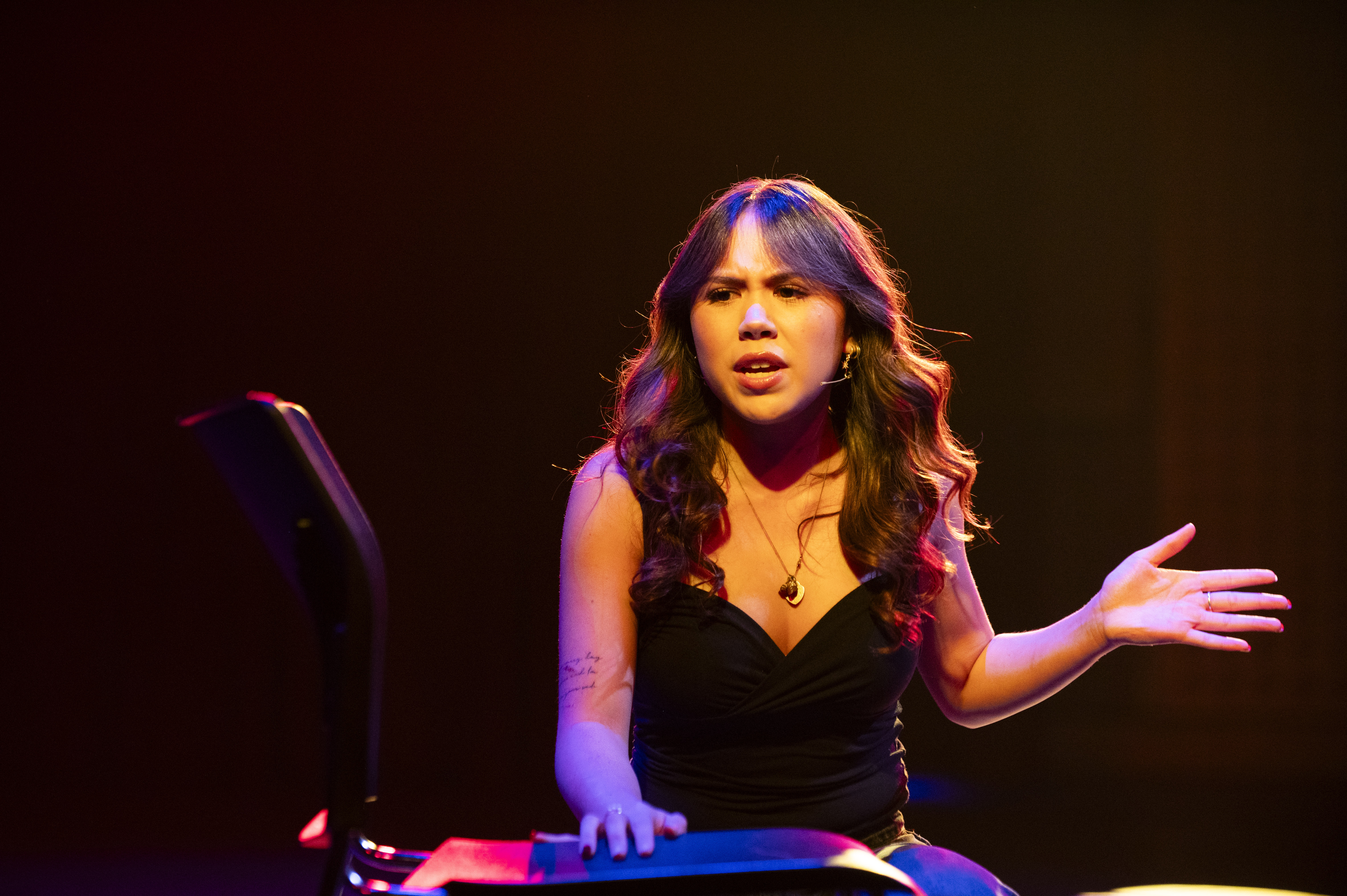 Young person performing theatre on stage