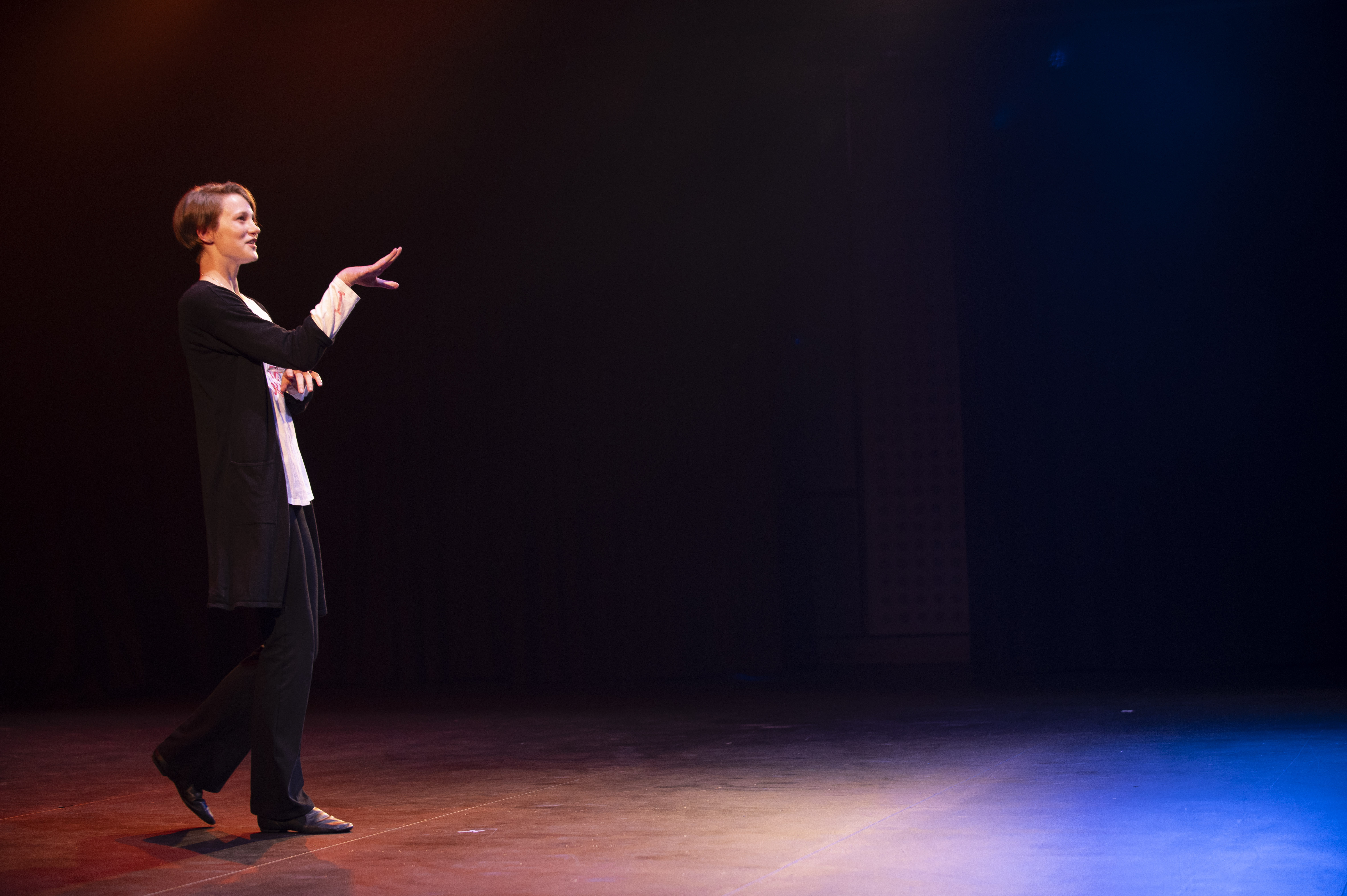 Young person performing theatre on stage
