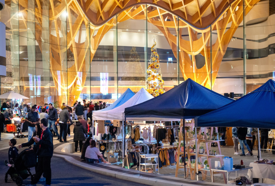 Christmas Market outside Bunjil Place with blue tents and lots of people browsing