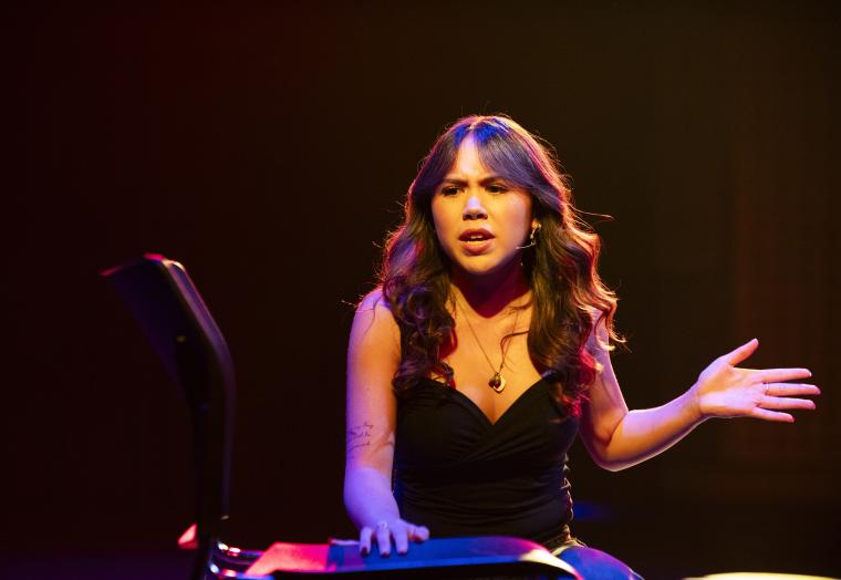 Young person performing theatre on stage