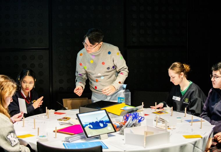 students participating in a workshop with architect and designer kelwin Wong