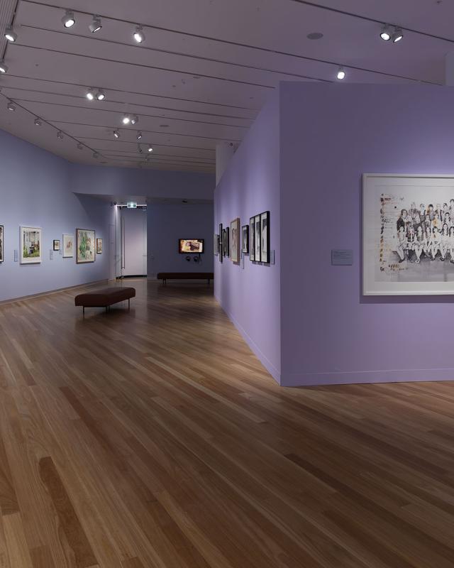 Installation view of an art gallery featuring purple walls and paintings in the distance: Jennifer Mills,‘In the  echo chamber’ Bunjil Place Gallery, 2025.  Photo: Christian Capurro