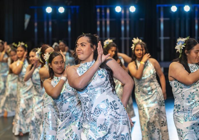 Young dancers on stage during the Cultivating Creative Cultures with Communities 2025 performances.