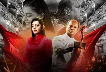 A woman in a red dress stands beside a man playing an instrument