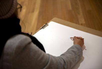 person sketching in the gallery
